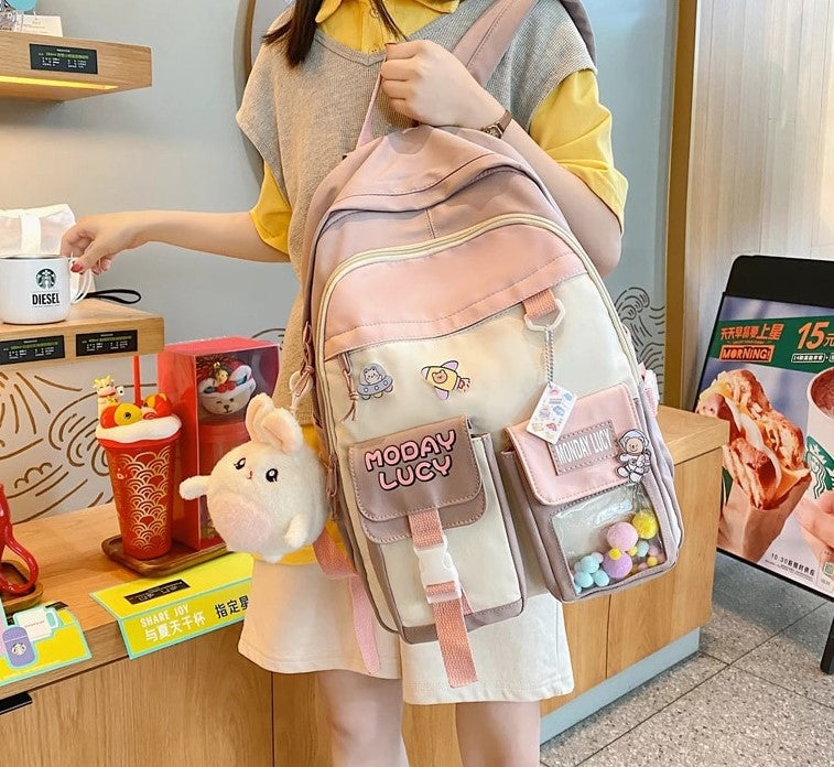 Load image into Gallery viewer, High quality women's back bag largely capacity many pockets Comes with a cute doll next to it
