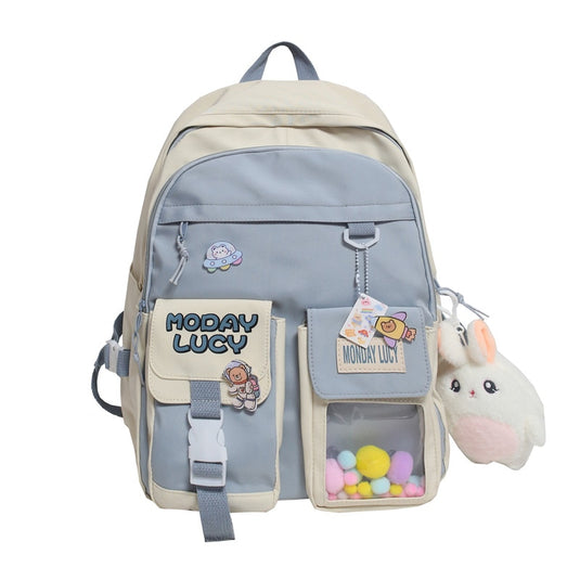 High quality women's back bag largely capacity many pockets Comes with a cute doll next to it