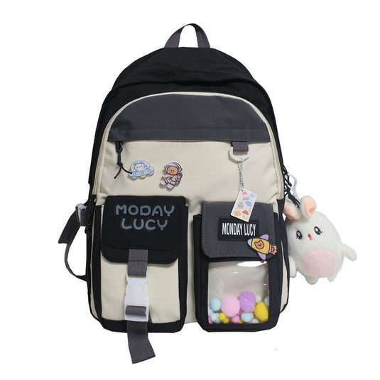 High quality women's back bag largely capacity many pockets Comes with a cute doll next to it