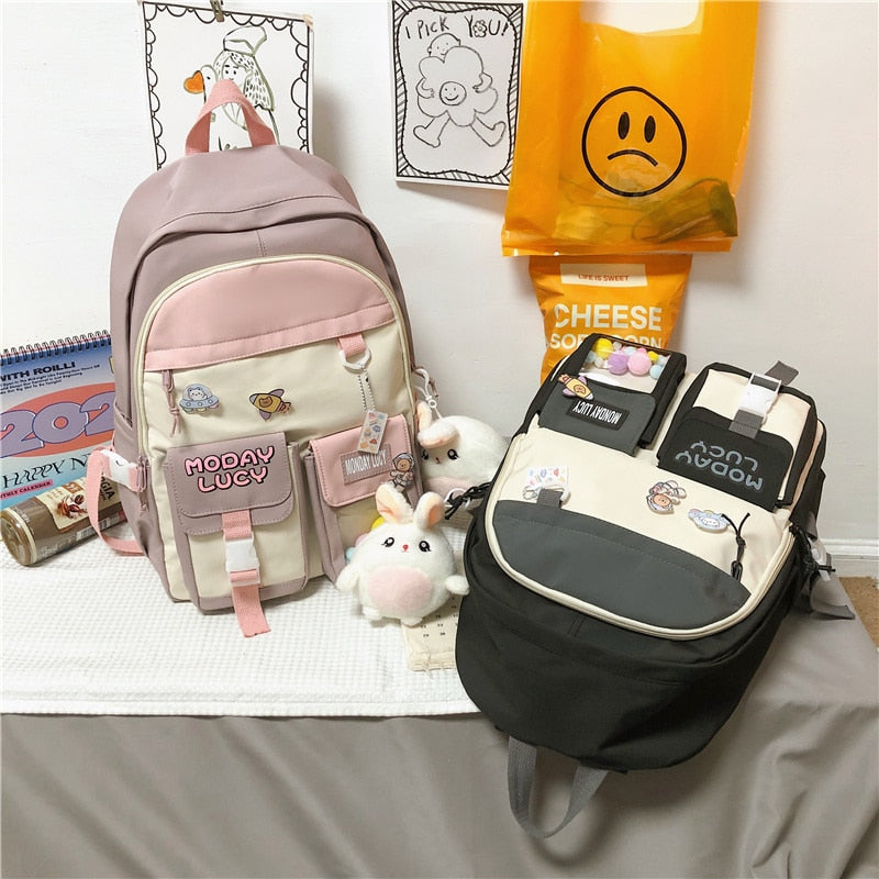 Load image into Gallery viewer, High quality women's back bag largely capacity many pockets Comes with a cute doll next to it
