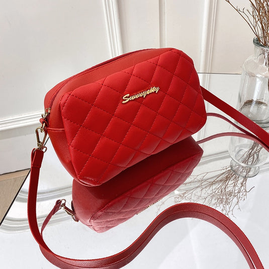 Stylish women's bag of soft leather, a brand and bright colors